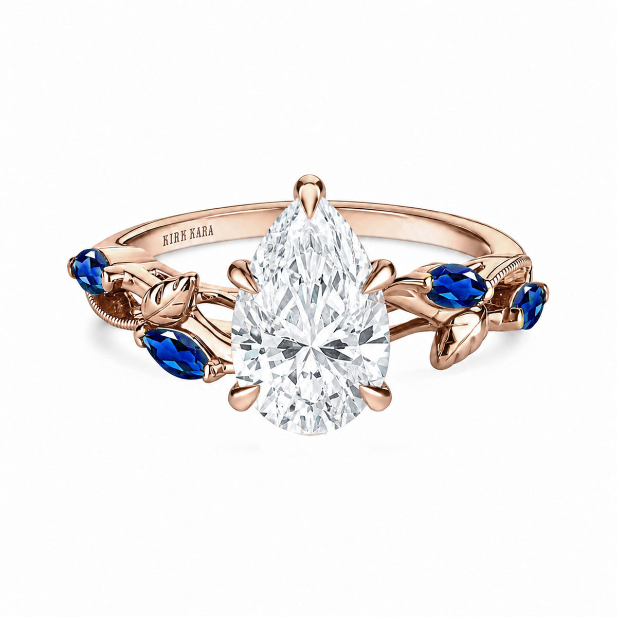 View of blue sapphire floral cathedral engagement ring.