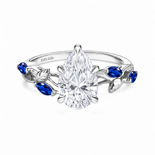 View of blue sapphire floral cathedral engagement ring.