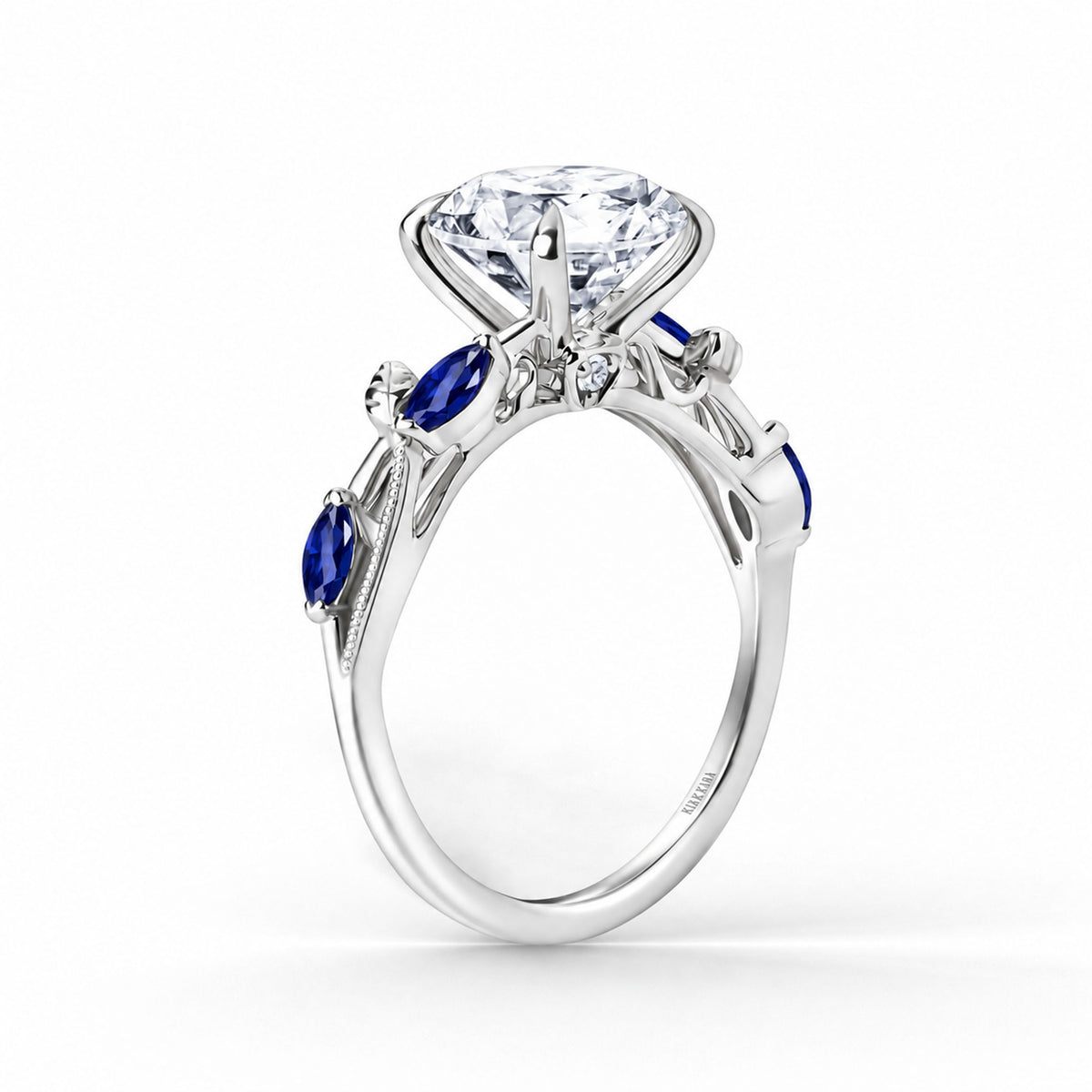 Angled view of blue sapphire floral cathedral engagement ring.