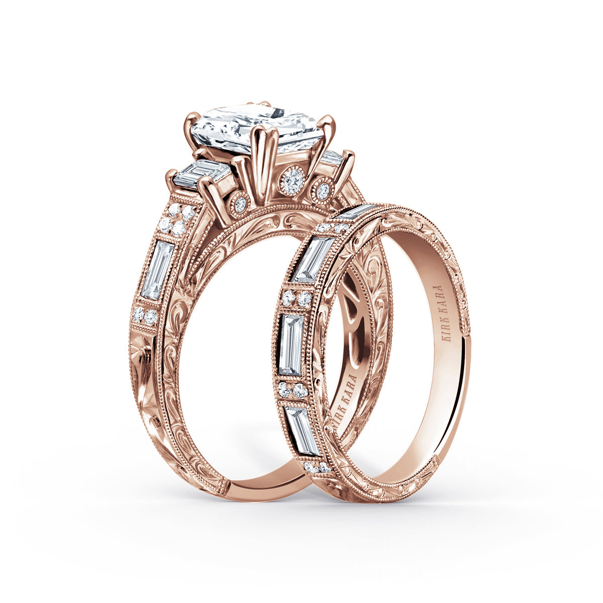 View of deco three-stone engraved baguette diamond engagement ring.