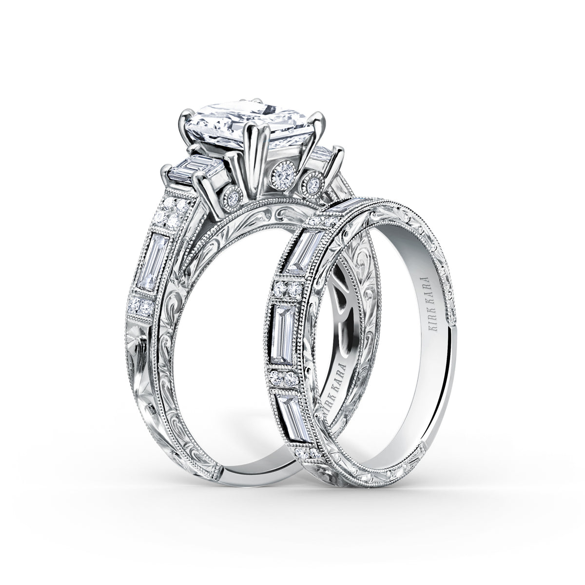 View of deco three-stone engraved baguette diamond engagement ring.