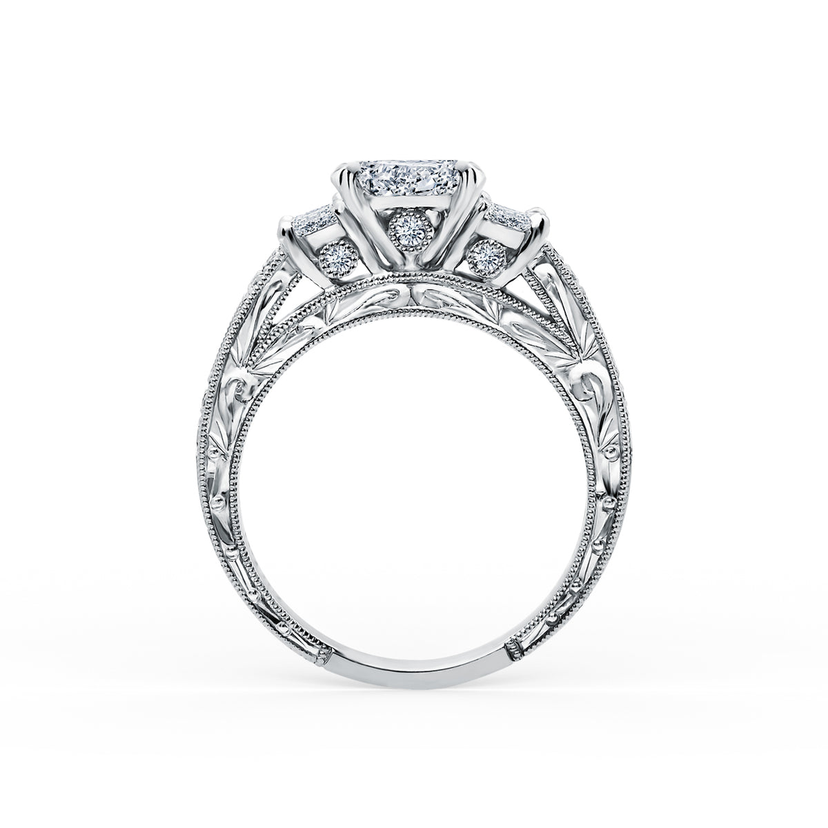 Side profile of deco three-stone engraved baguette diamond engagement ring.