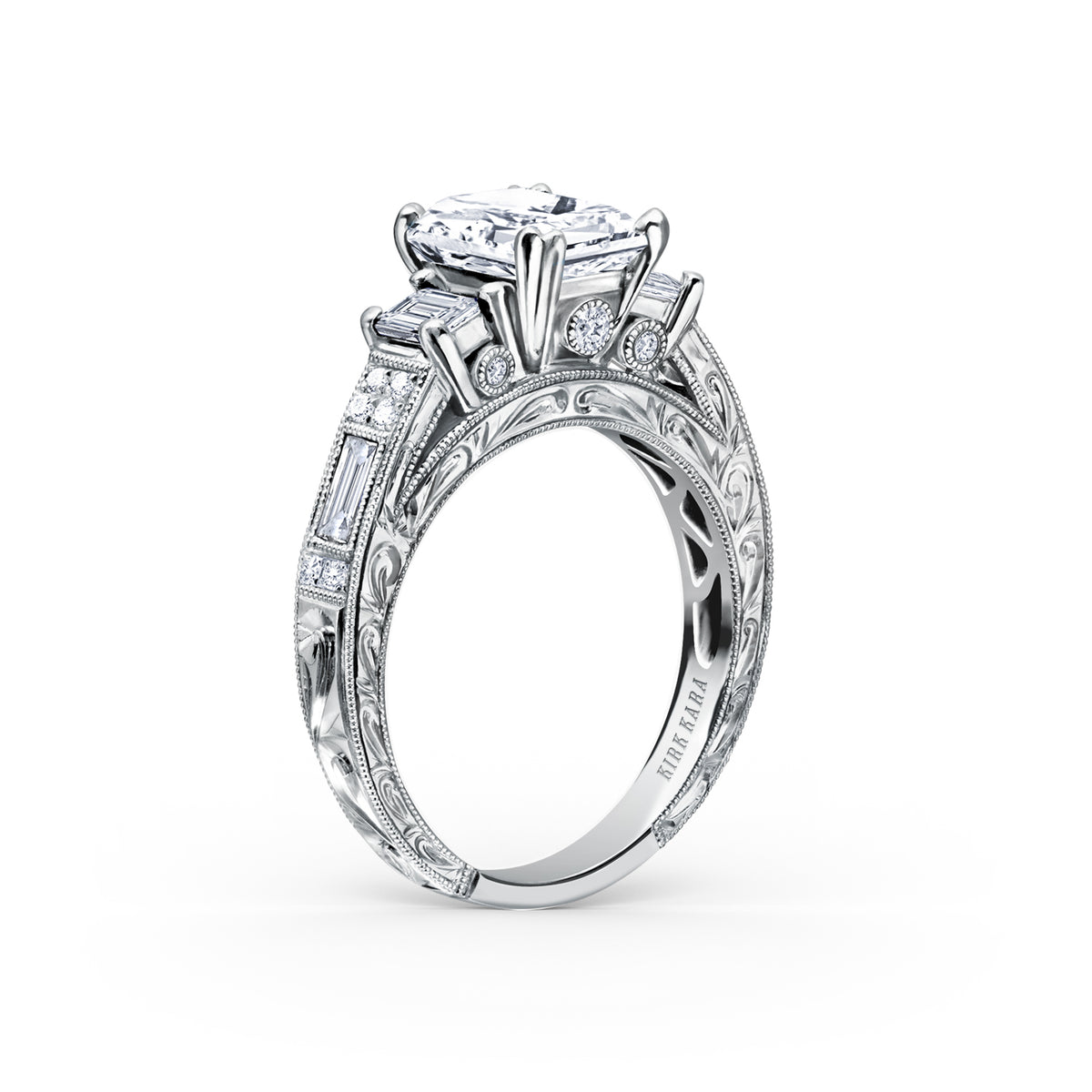 View of deco three-stone engraved baguette diamond engagement ring.