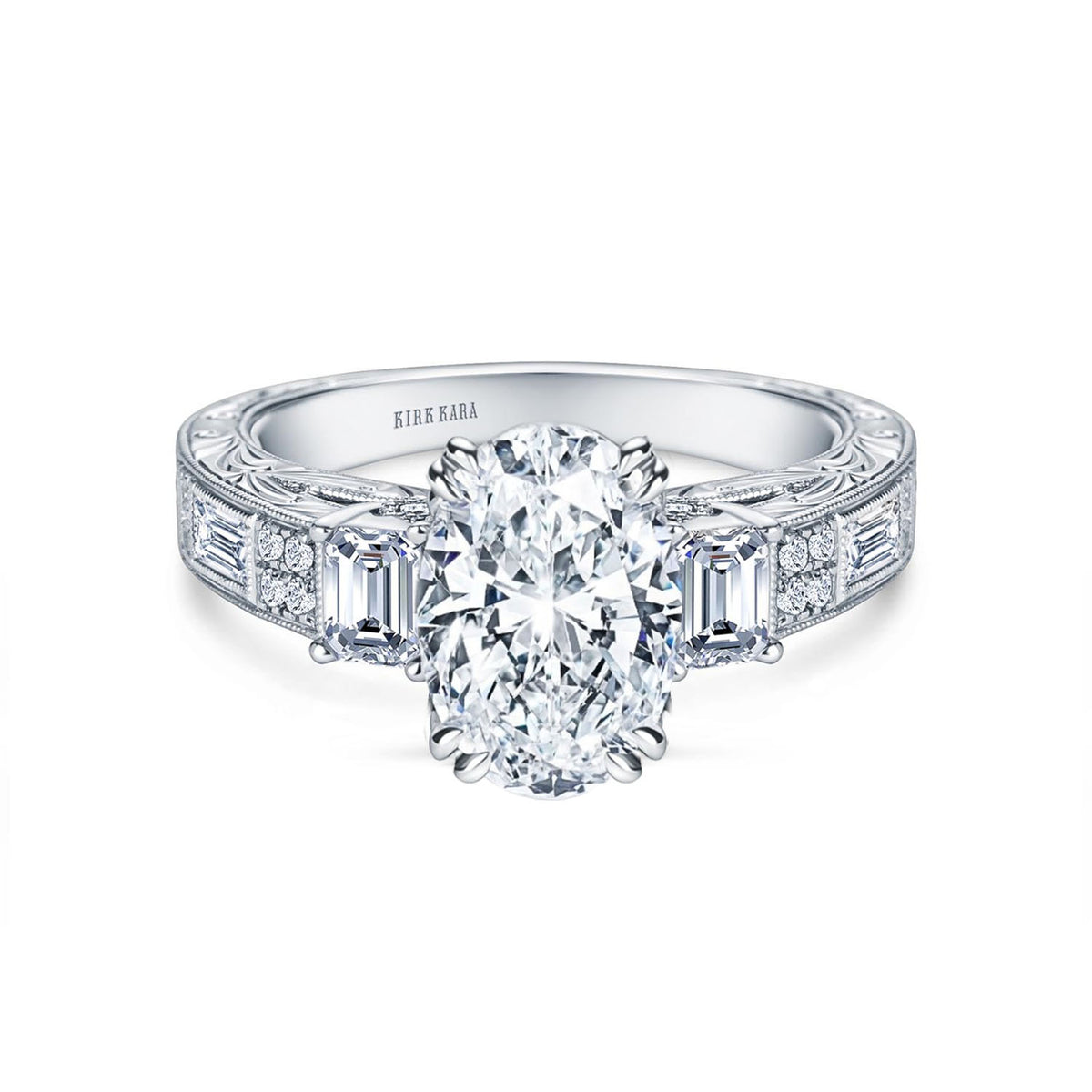 View of deco three-stone engraved baguette diamond engagement ring.