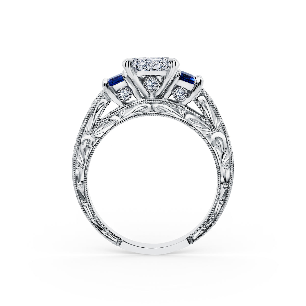 Side profile of deco three-stone engraved sapphire baguette diamond engagement ring.