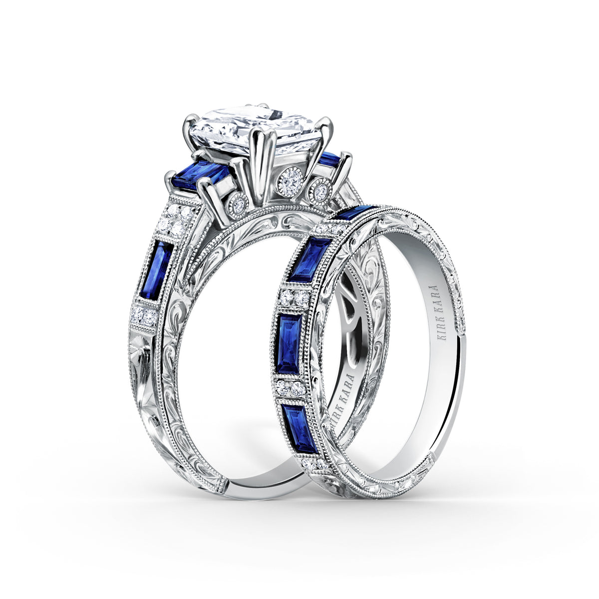View of deco three-stone engraved sapphire baguette diamond engagement ring.