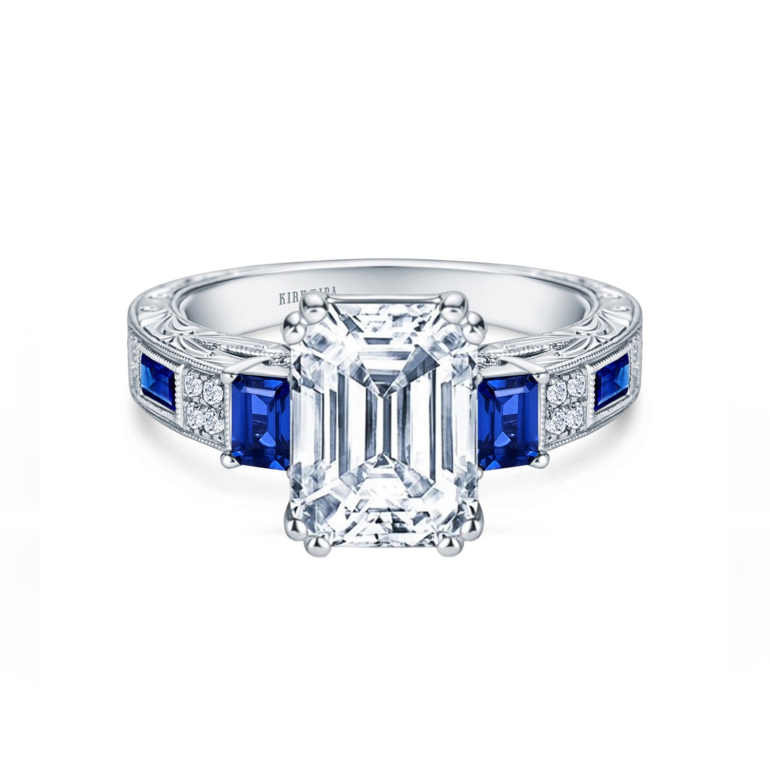 View of deco three-stone engraved sapphire baguette diamond engagement ring.