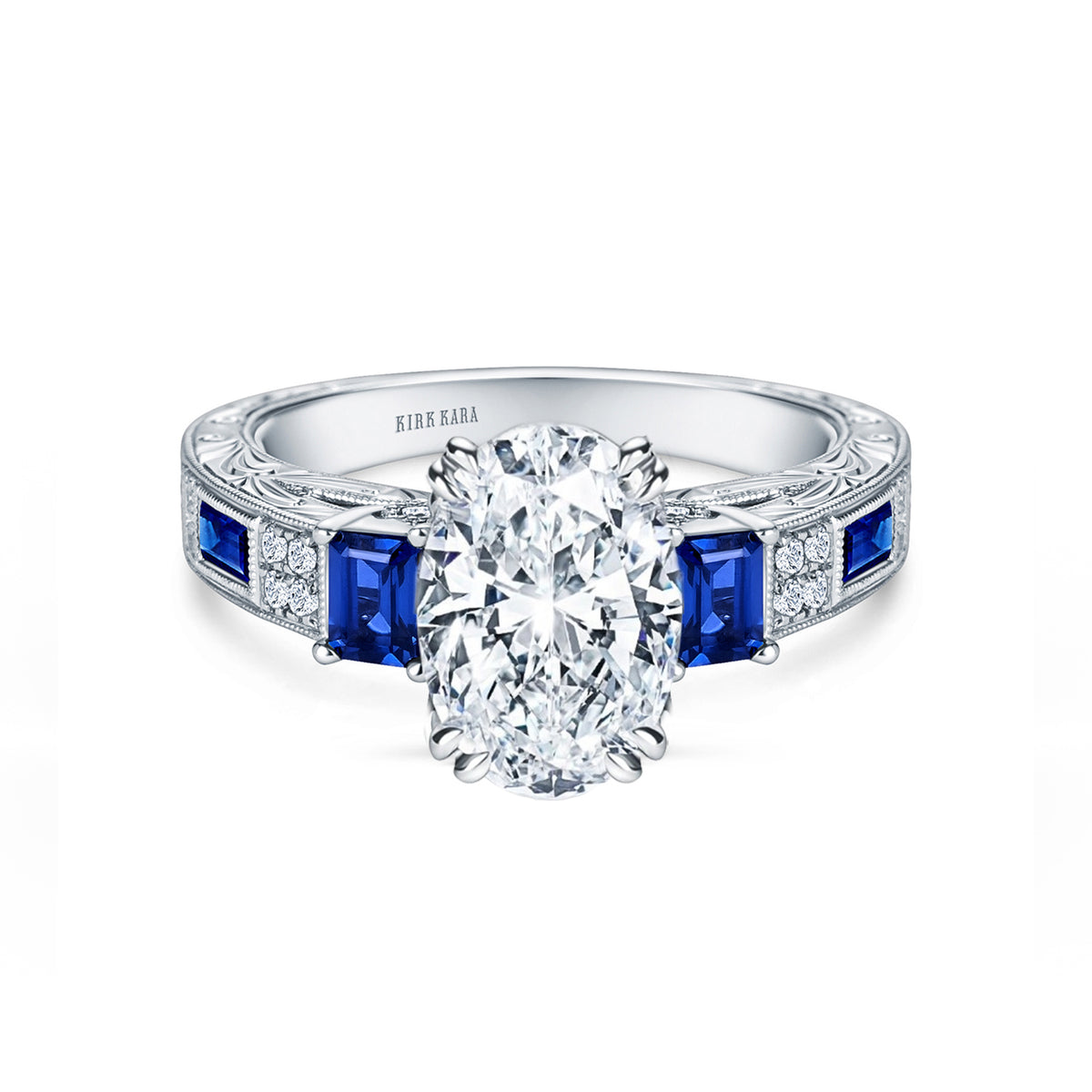 View of deco three-stone engraved sapphire baguette diamond engagement ring.