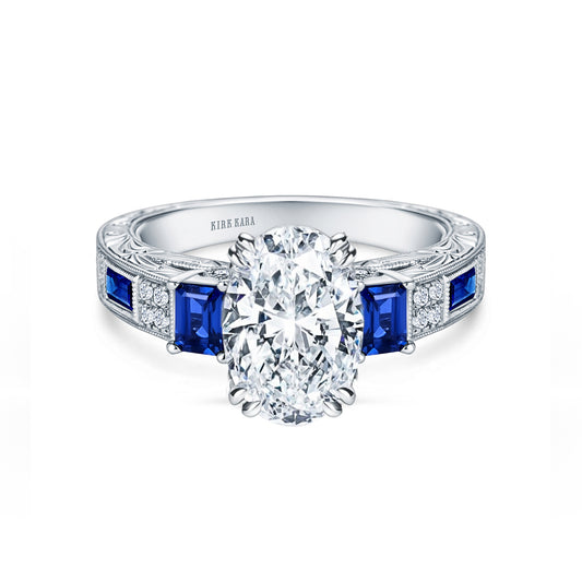 View of deco three-stone engraved sapphire baguette diamond engagement ring.