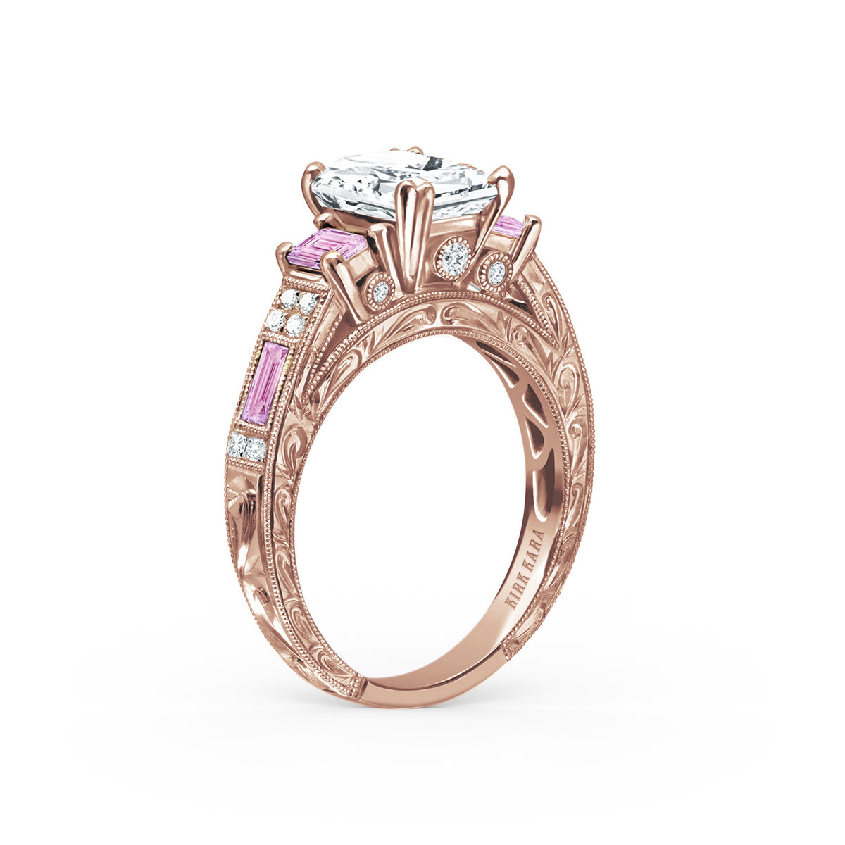 Angled view of deco three-stone engraved sapphire baguette diamond engagement ring.