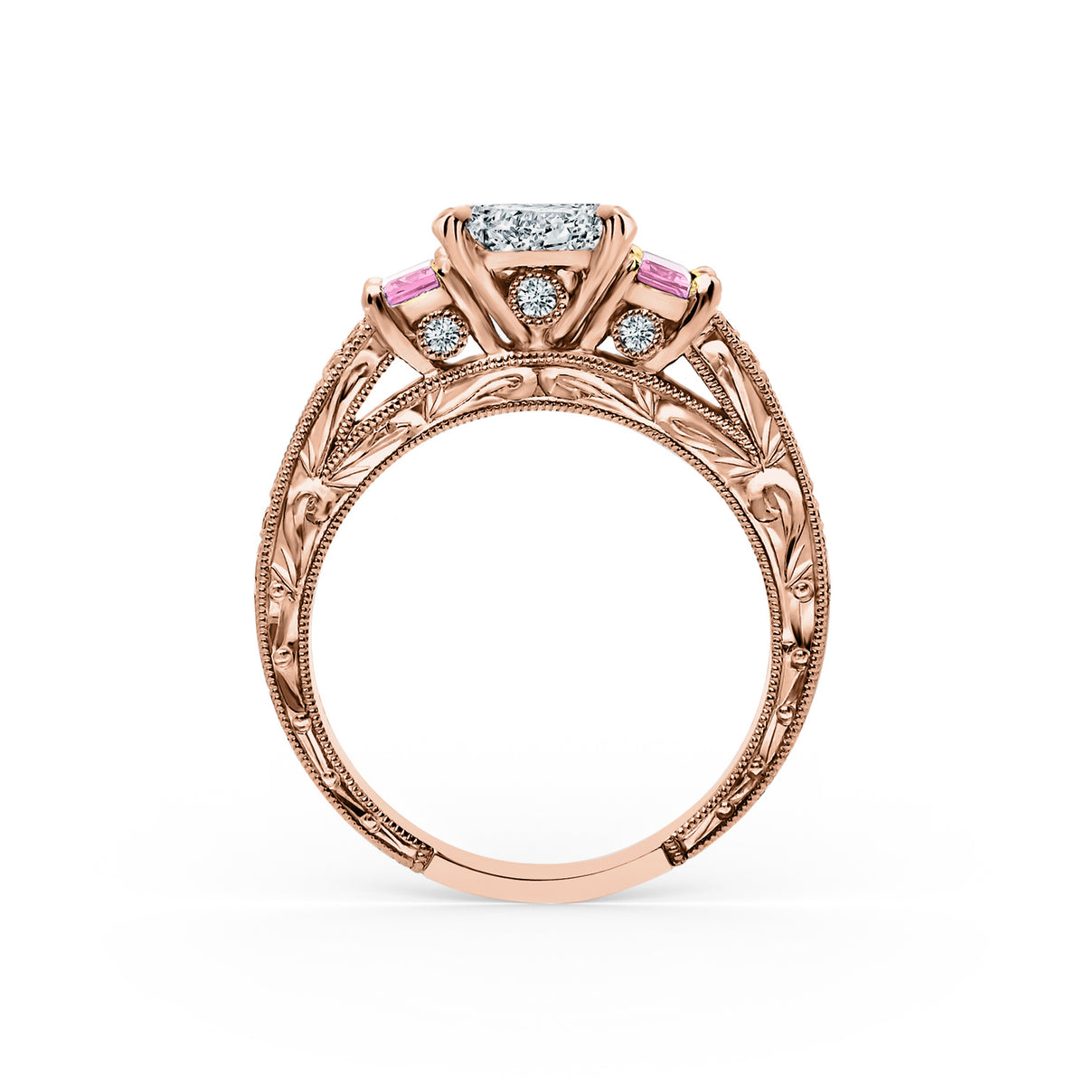 Side profile of deco three-stone engraved sapphire baguette diamond engagement ring.