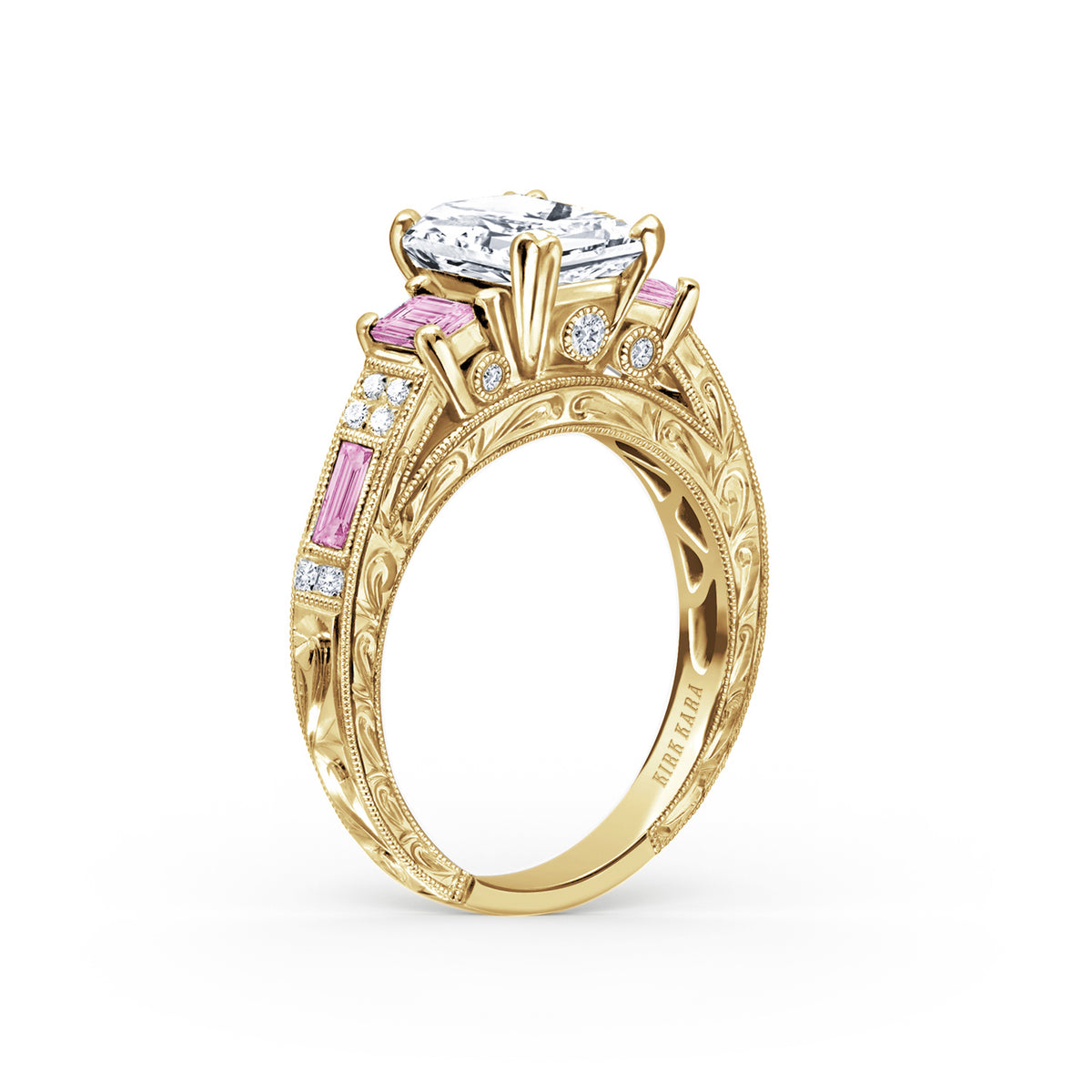 Angled view of deco three-stone engraved sapphire baguette diamond engagement ring.
