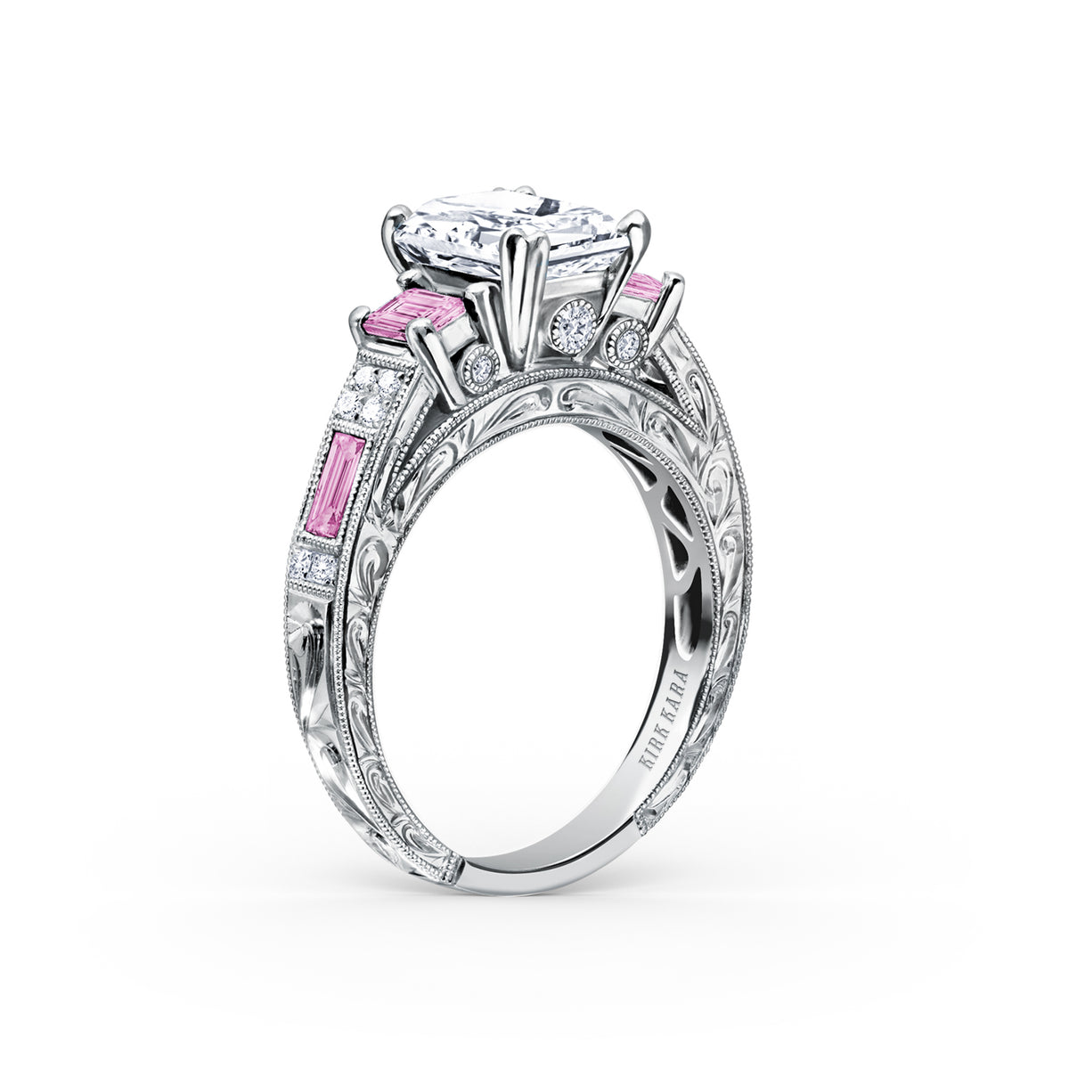 View of deco three-stone engraved sapphire baguette diamond engagement ring.