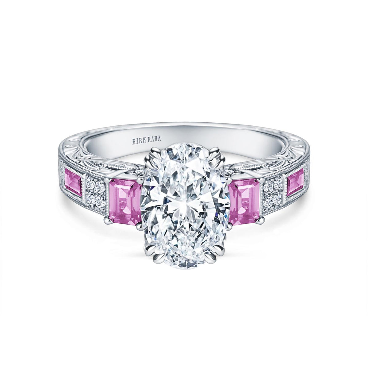 View of deco three-stone engraved sapphire baguette diamond engagement ring.