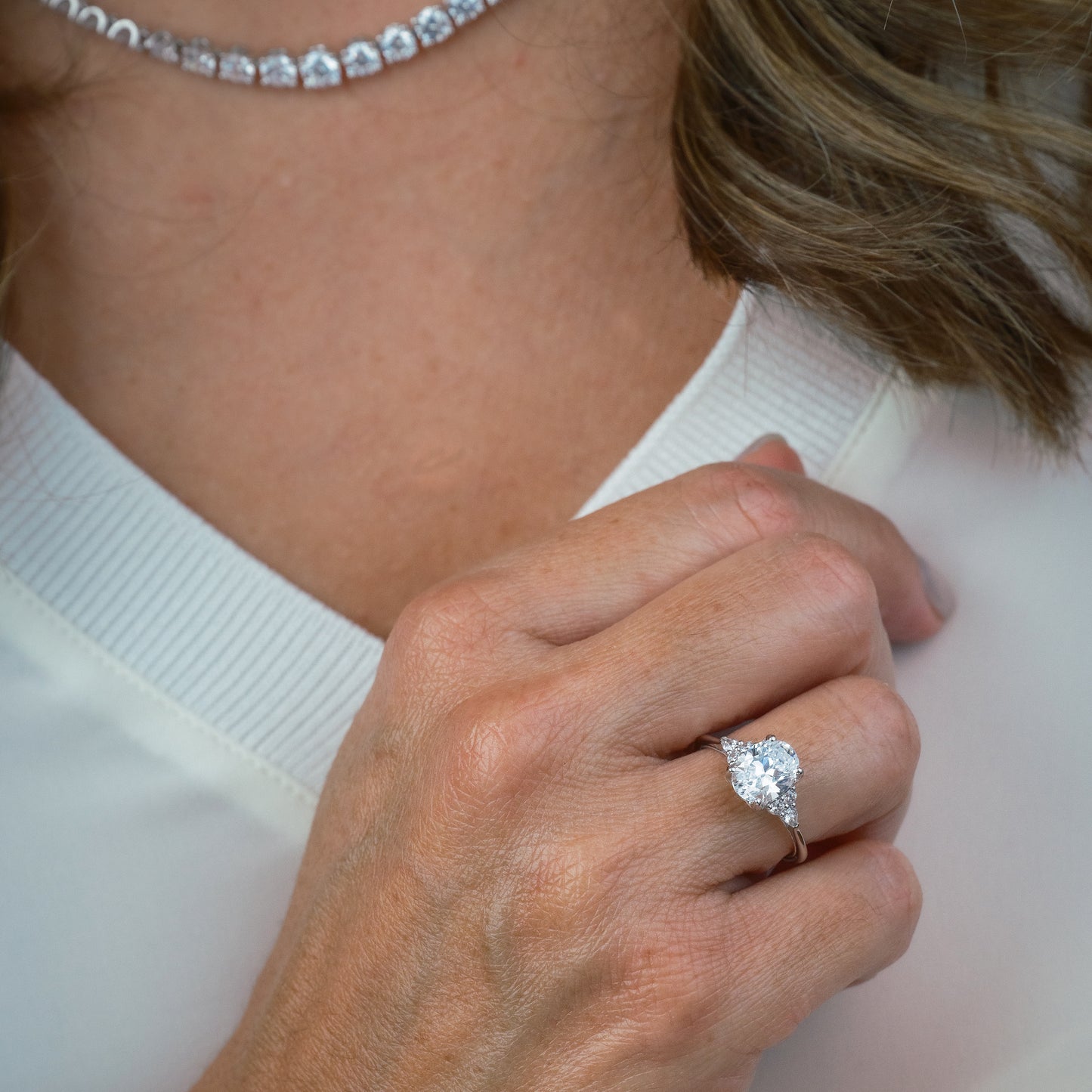 Pear & Round Diamond Side Stone Engagement Ring