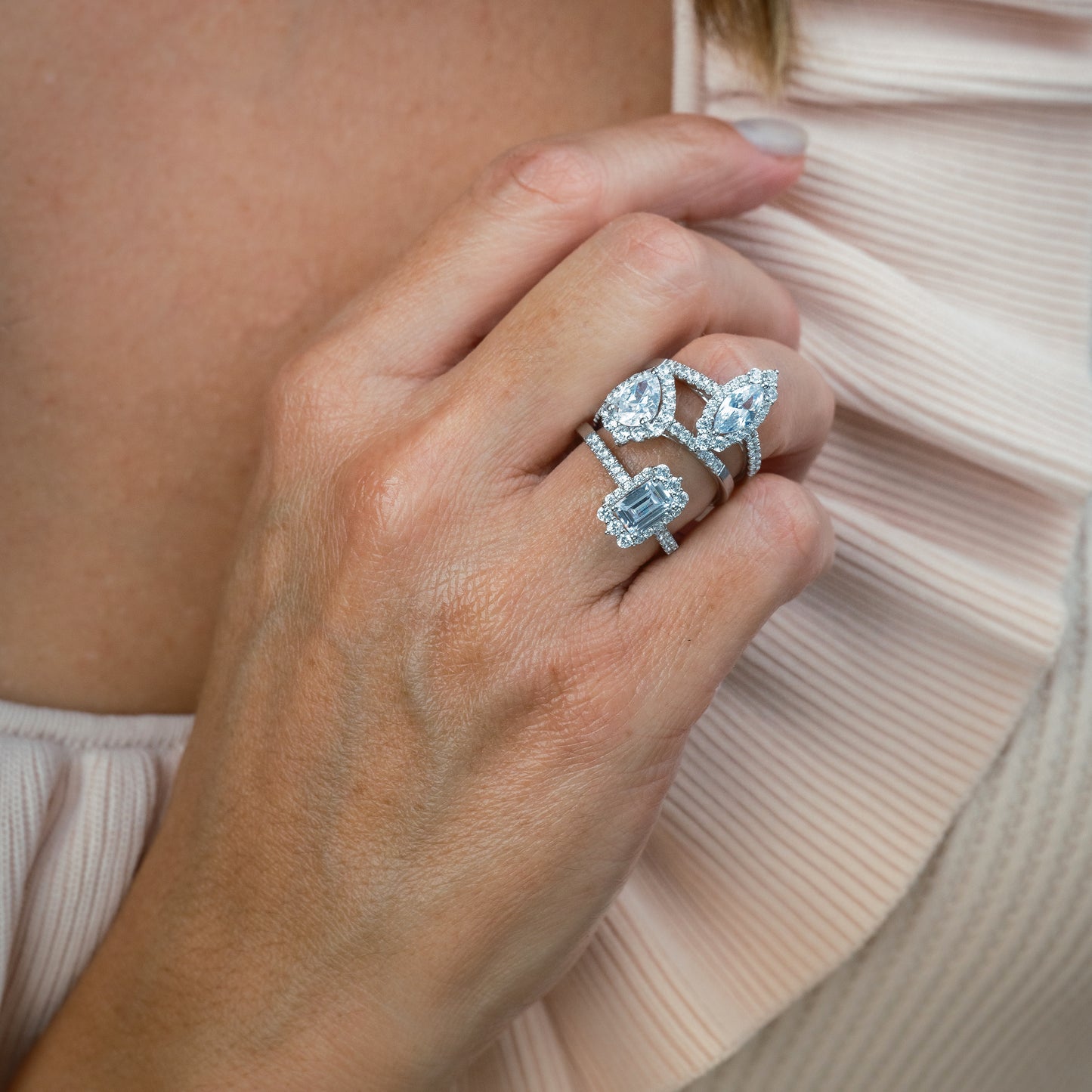 Elegant Pear Graduated Halo Diamond Engagement Ring