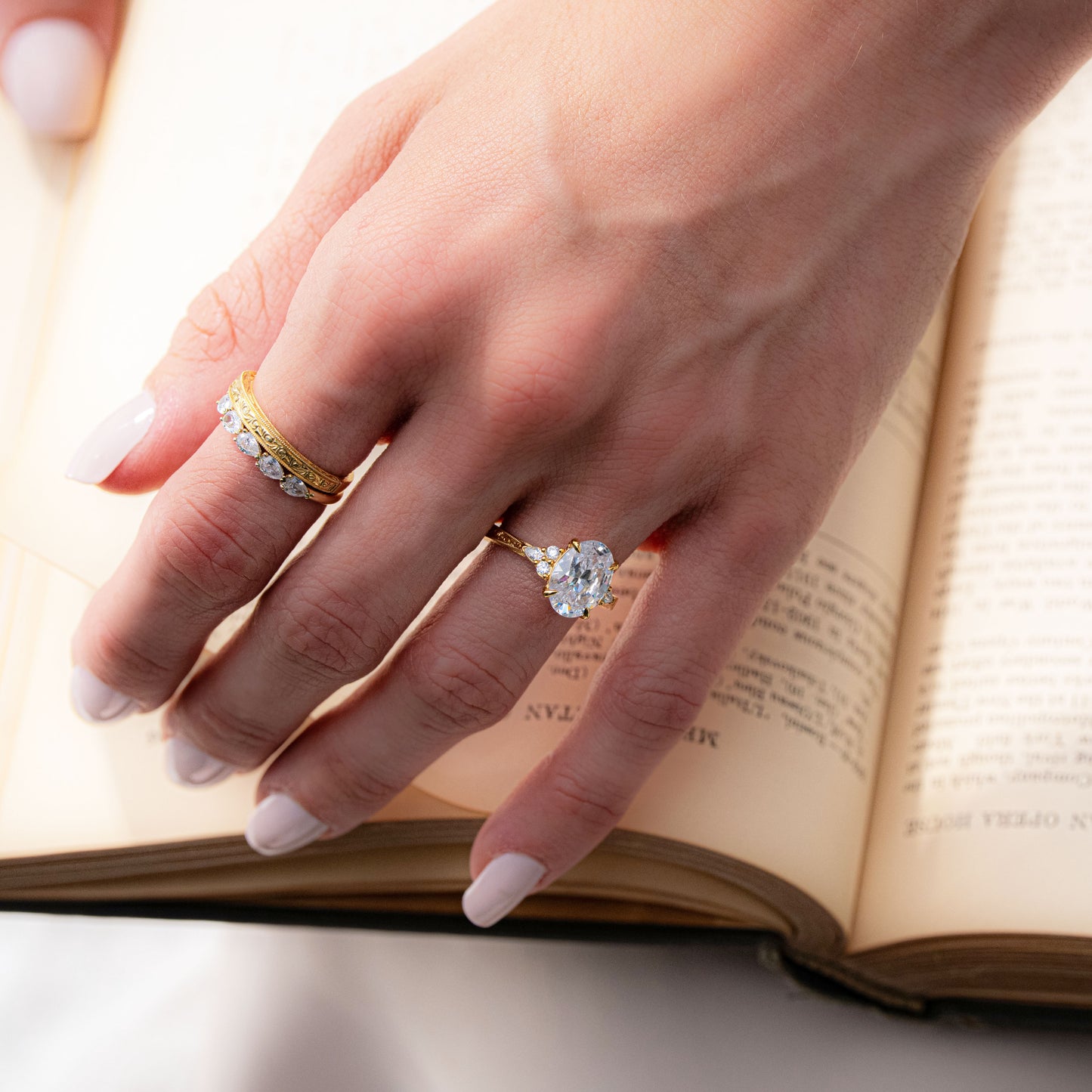 Scroll-Engraved Pear & Round Diamond Side Stone Engagement Ring
